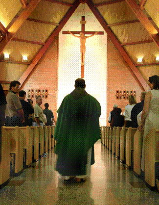 Photo of a friar processing into church